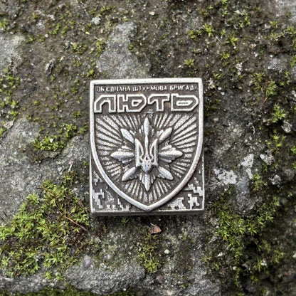 Молле кліпса з емблемою Об'єднаної штурмової бригади Нацполіції України Лють