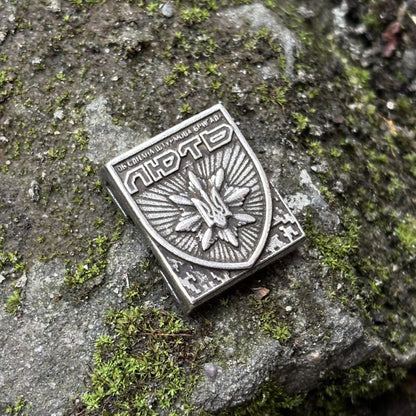 Молле кліпса з емблемою Об'єднаної штурмової бригади Нацполіції України Лють